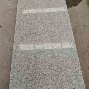 榆林芝麻白光面毛板